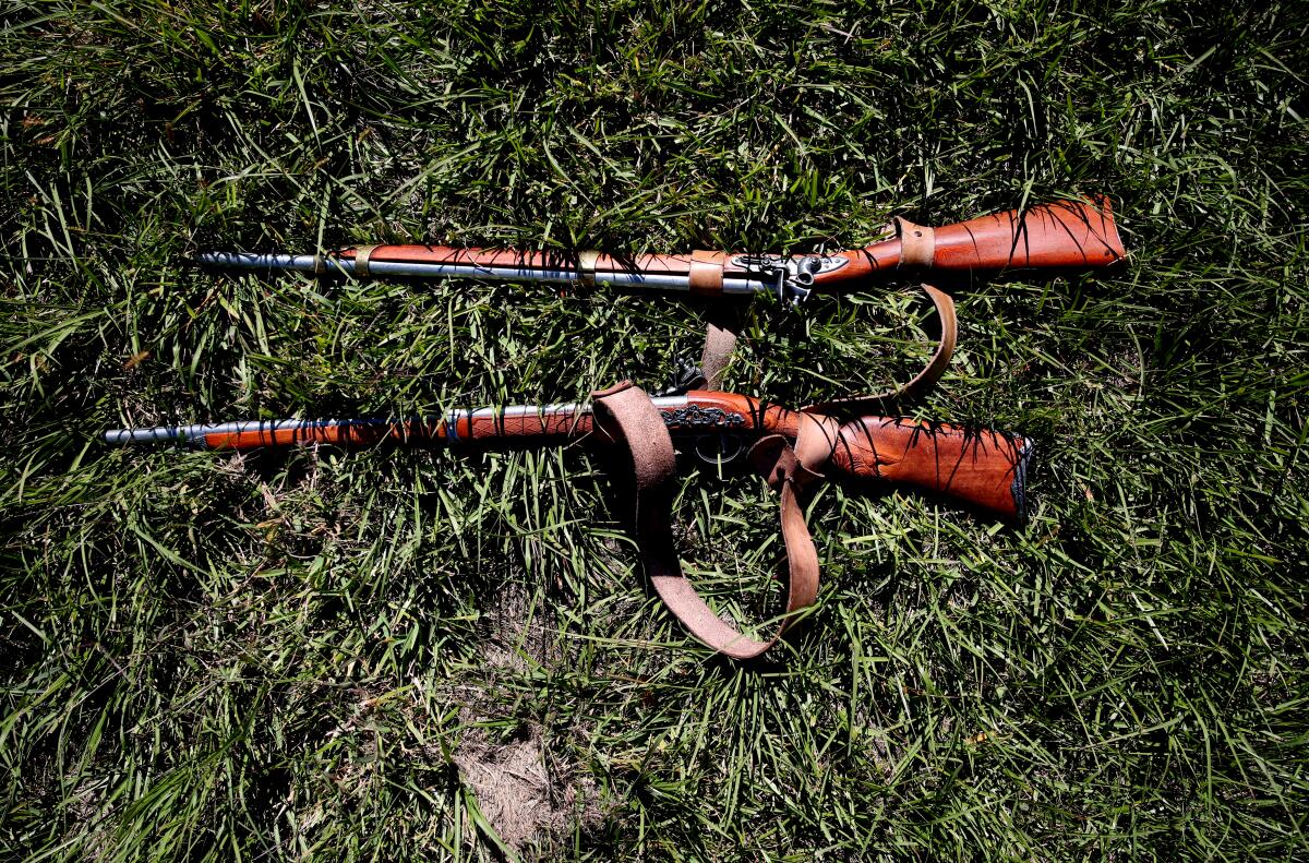 Period rifles and other artifacts were used in the reenactment.