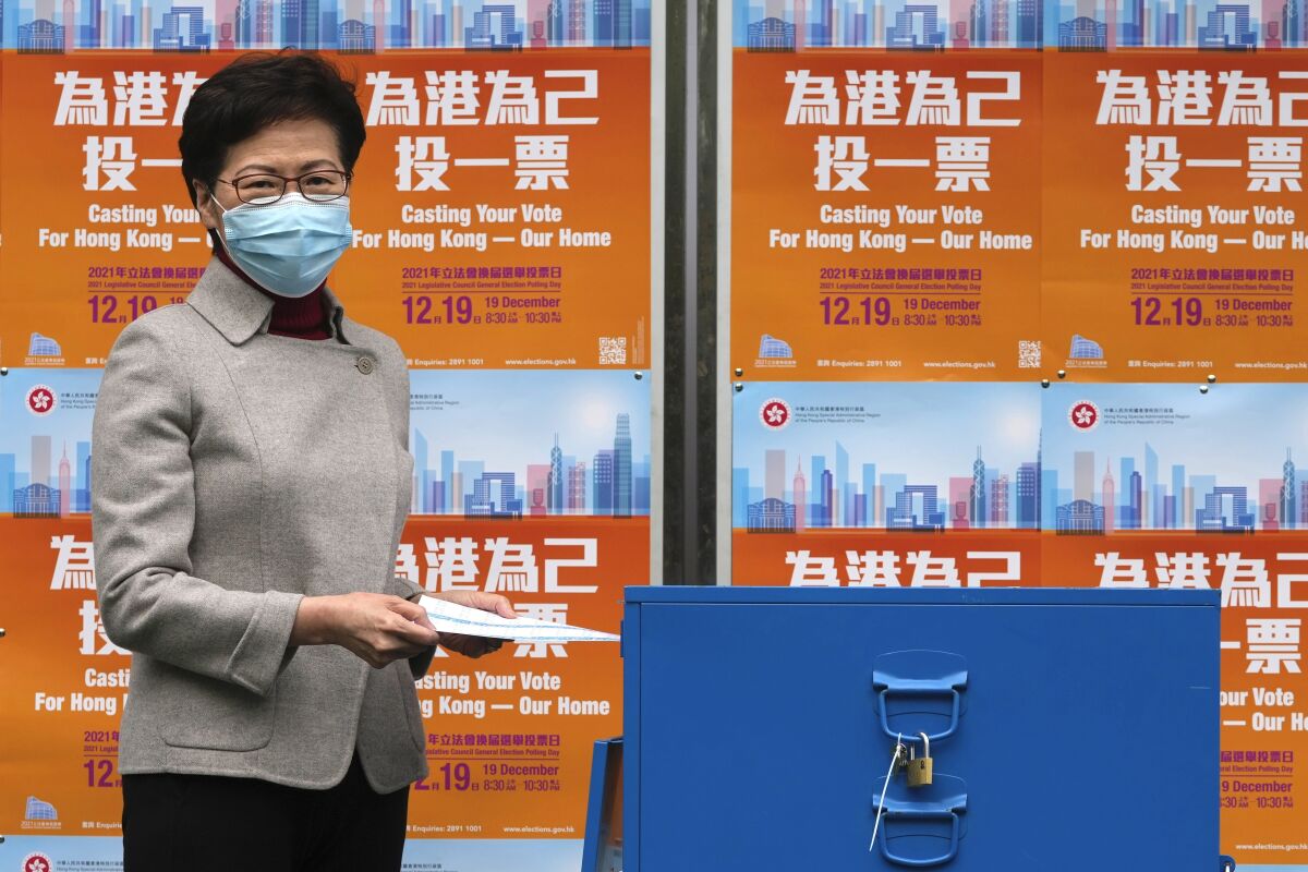 Hong Kong Chief Executive Carrie Lam casts her ballot at a polling station in Hong Kong on Sunday.