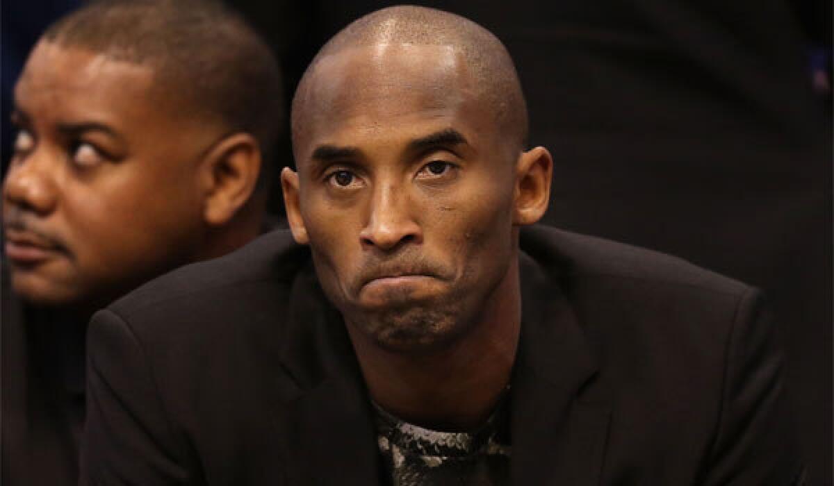 Kobe Bryant watches from the bench as the Lakers play the Phoenix Suns on the road on Jan. 15. Bryant has played in only six games this season.