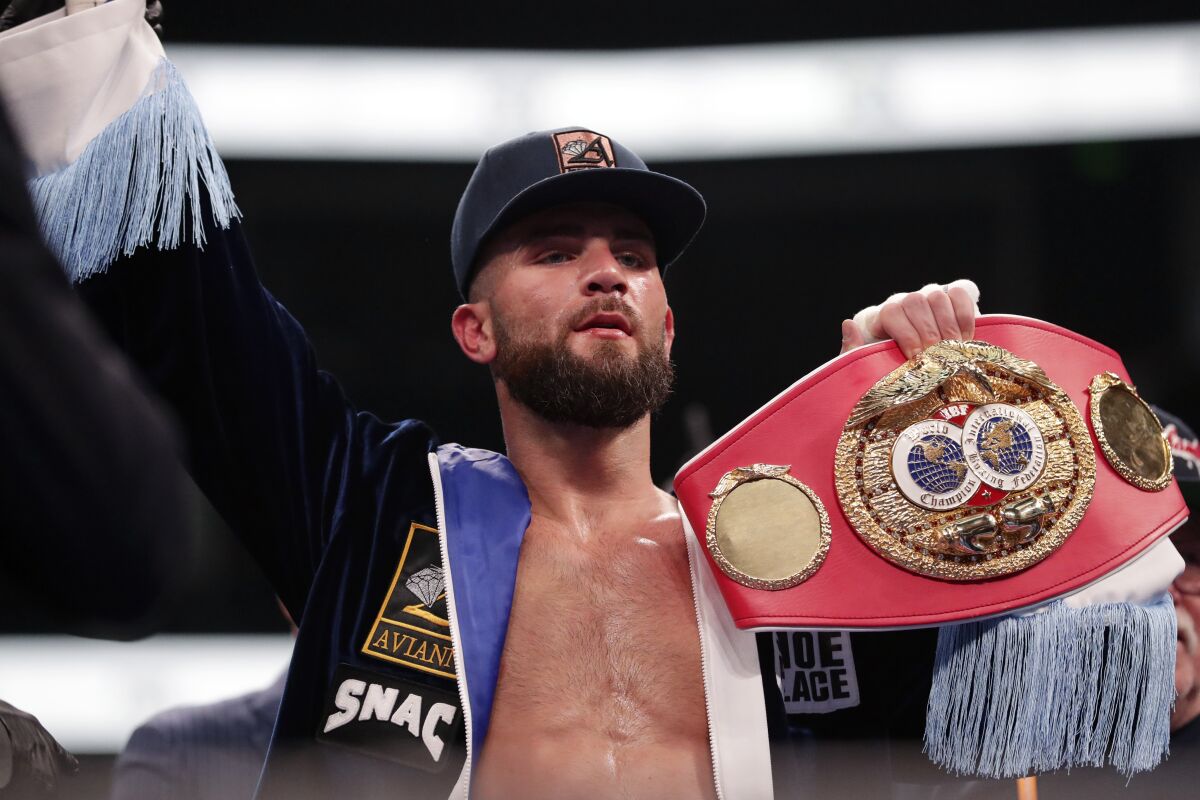 Caleb Plant holds his IBF super middleweight championship title belt after defeating Vincent Feigenbutz