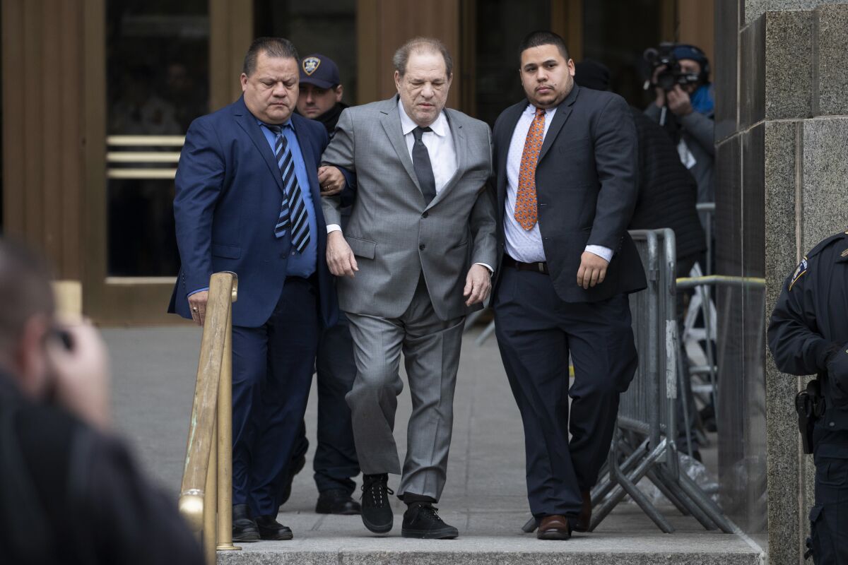 Harvey Weinstein, center, leaves court following a bail hearing, Friday, Dec. 6, 2019 in New York. 