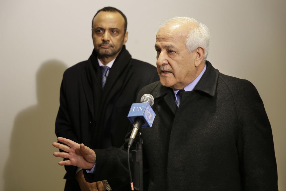 Palestinian Ambassador to the United Nations Riyad Mansour speaks to reporters Tuesday. In the background is Mauritanian Ambassador Sidi Mohamed Boubacar.