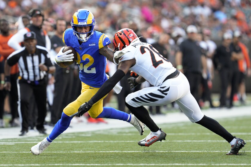 Rams wide receiver Lance McCutcheon tries to get past Bengals safety Tycen Anderson on Aug. 27, 2022.
