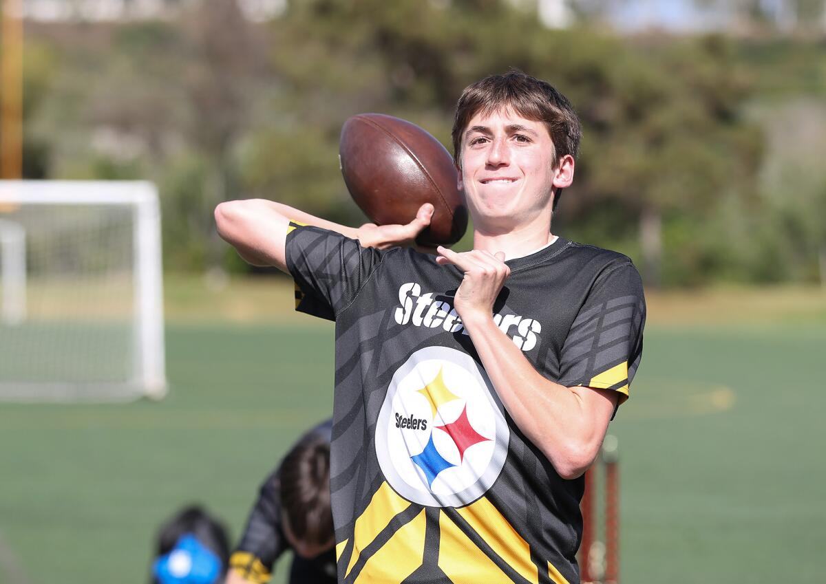Quarterback Dylan Dallal, of the Costa Mesa Steelers flag football team, throws a pass on Monday at Bonita Creek Park.