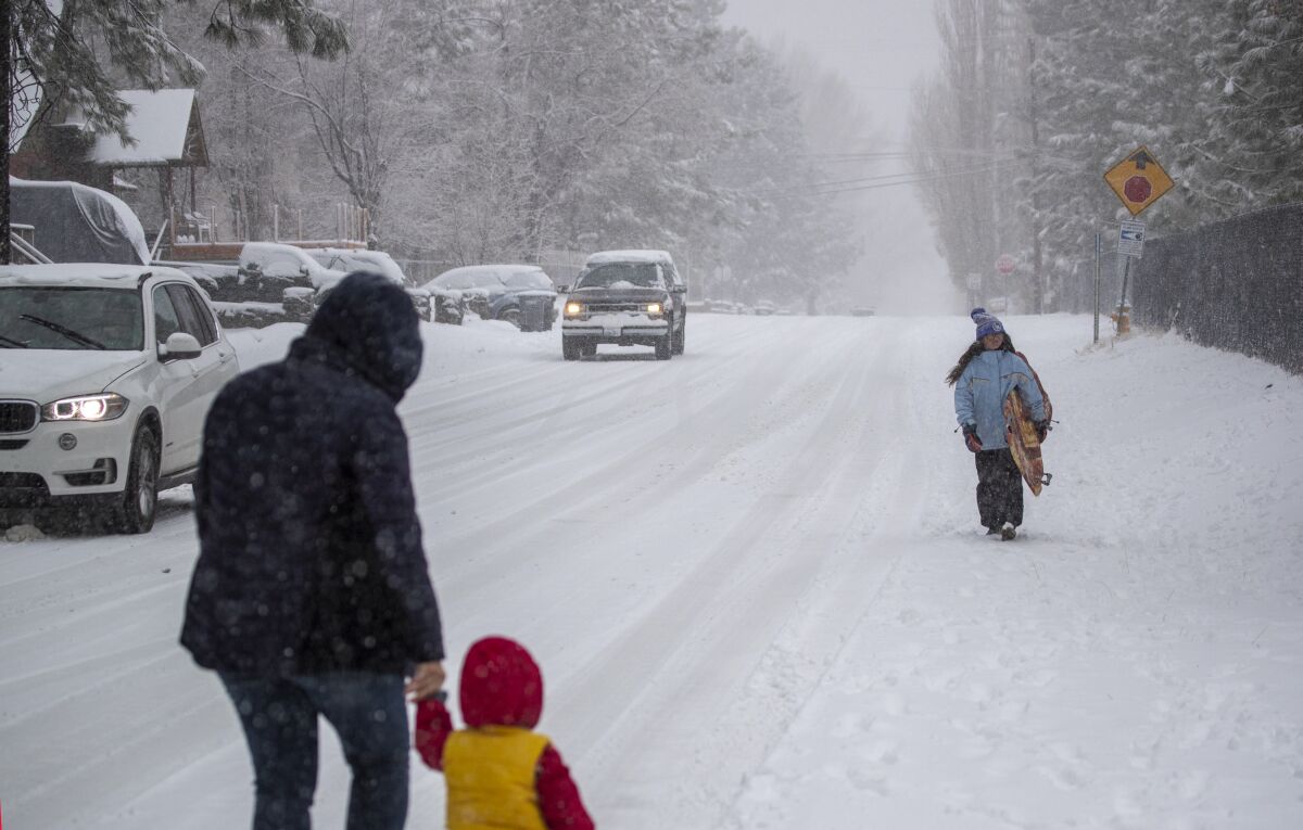 Heavy snow covered streets and lured sledders in Wrightwood on Thanksgiving Day.