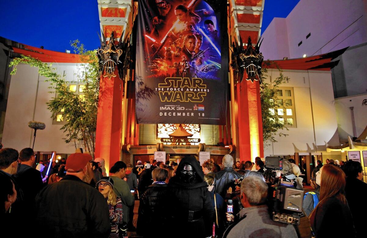 “Star Wars: The Force Awakens” sold a record $57 million in tickets Thursday. Above, fans at the TCL Chinese Theatre.