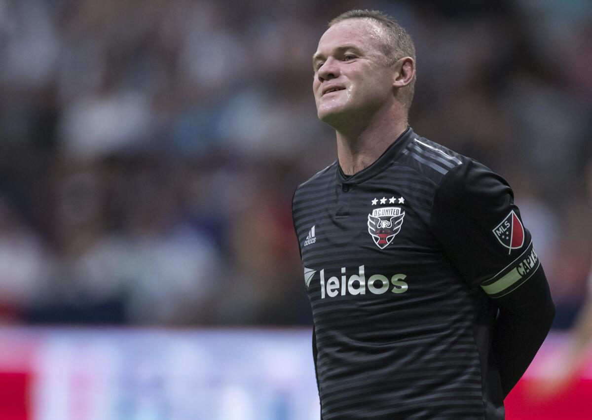 D.C. United's Wayne Rooney reacts after putting a shot over top of the Vancouver Whitecaps' goal during the first half of an MLS soccer match Saturday, Aug. 17, 2019, in Vancouver, British Columbia. (Darryl Dyck/The Canadian Press via AP)