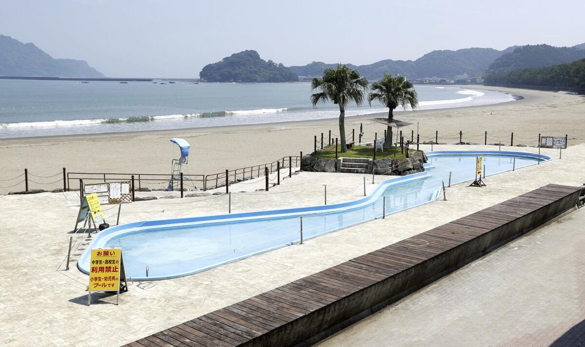 A deserted beach and nearby pool