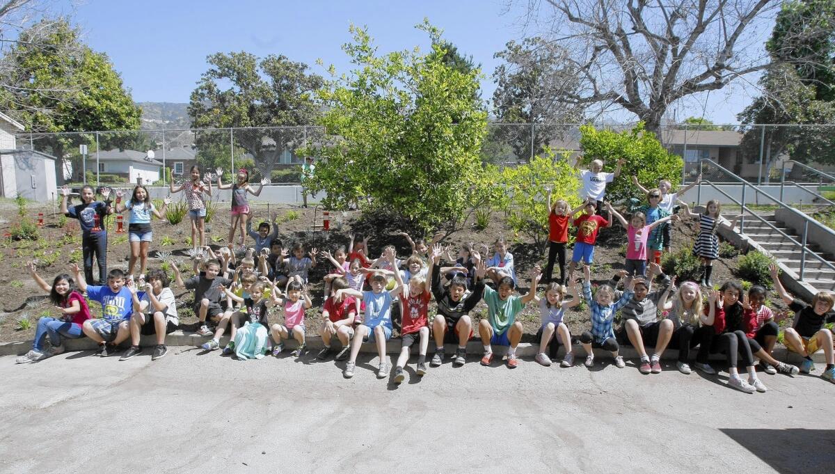 First and fifth graders at the Jefferson Elementary School hummingbird and butterfly garden at the Burbank school's campus on Tuesday, April 15, 2014. The garden is maintained by first and fifth grader students.