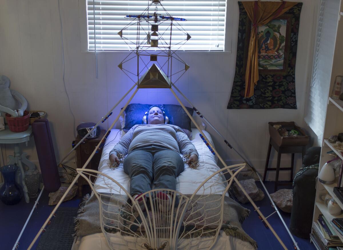 Lori Carter, a local medium, has color therapy treatment at the Cassadaga Spiritualist Camp.