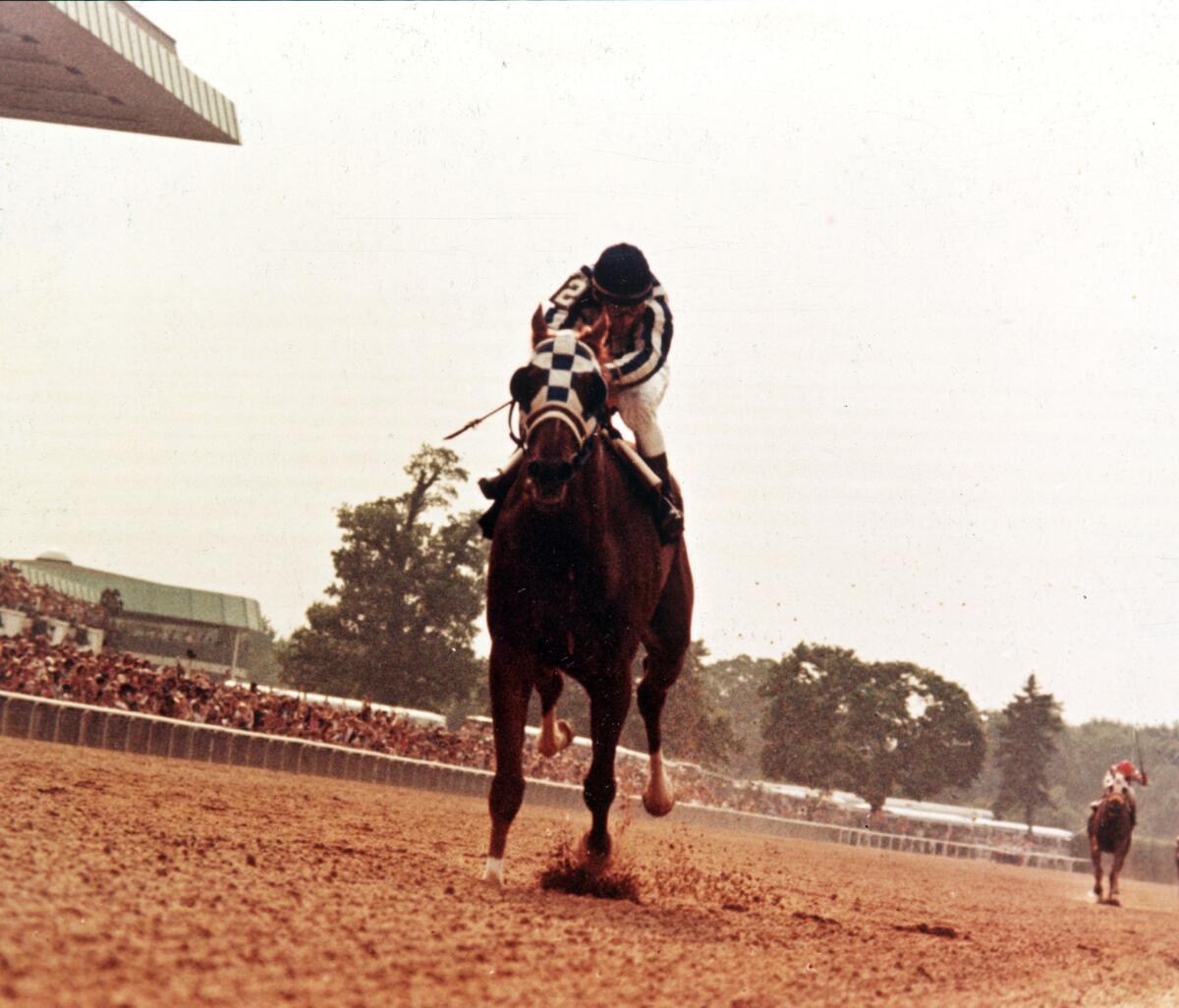 Ron Turcotte rides Secretariat to a Triple Crown victory at the Belmont Stakes on June 9, 1973. 