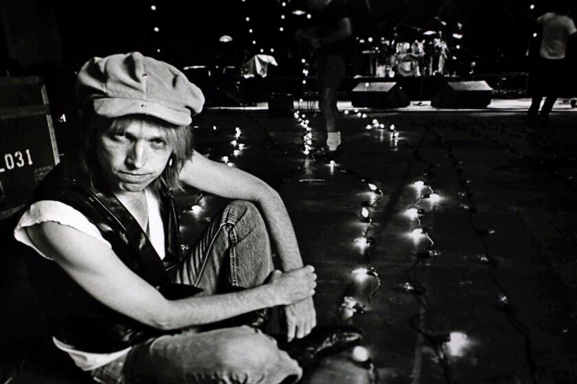 Los Angeles Times photo of Tom Petty on stage for a sound check in Burbank during a May, 1987 tour. Los Angeles Times photo by Ellen Jascol