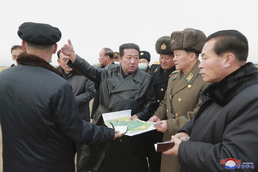 In this undated photo provided by the North Korean government, its leader Kim Jong Un, center, inspects an area planned for a vegetable greenhouse farm in the Ryonpho area of Hamju county, South Hamgyong province, northeast of Pyongyang, North Korea. Independent journalists were not given access to cover the event depicted in this image distributed by the North Korean government. The content of this image is as provided and cannot be independently verified. Korean language watermark on image as provided by source reads: "KCNA" which is the abbreviation for Korean Central News Agency. (Korean Central News Agency/Korea News Service via AP)