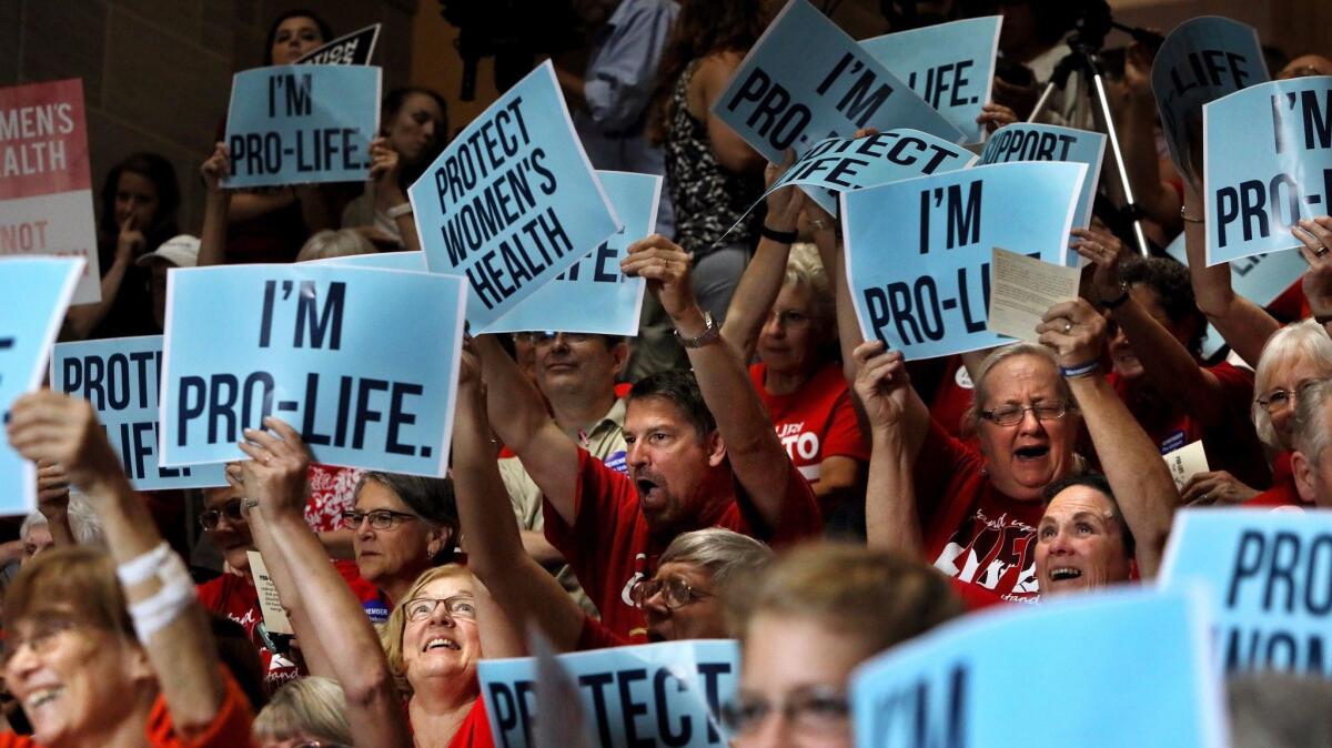 Opponents of abortion cheer during a rally in Jefferson City, Mo., on June 14. (David Carson / Associated Press)