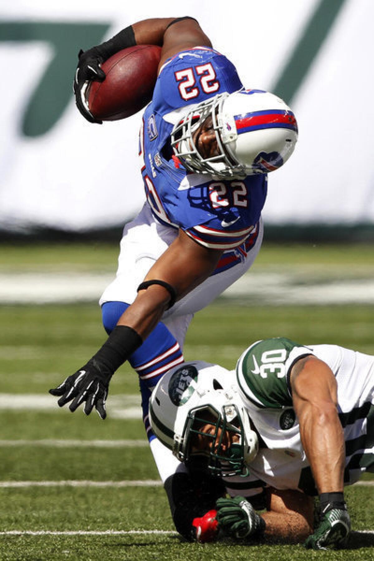 Buffalo Bills running back Fred Jackson is hit by New York Jets defensive back LaRon Landry during the first half. Jackson was injured on the play.