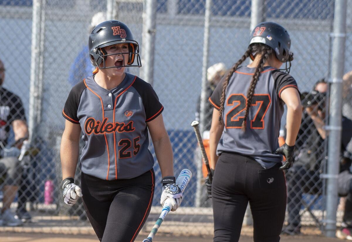 Huntington Beach High's Devyn Greer (25), seen celebrating after scoring a run against Norco on May 24, 2018, helped the Oilers beat Corona del Mar 15-1 Tuesday.