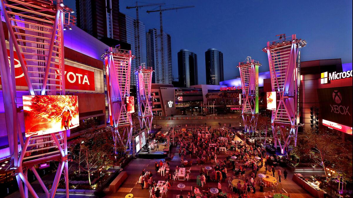 A crowd inside the courtyard at L.A. Live in downtown Los Angeles during a private event in 2018.