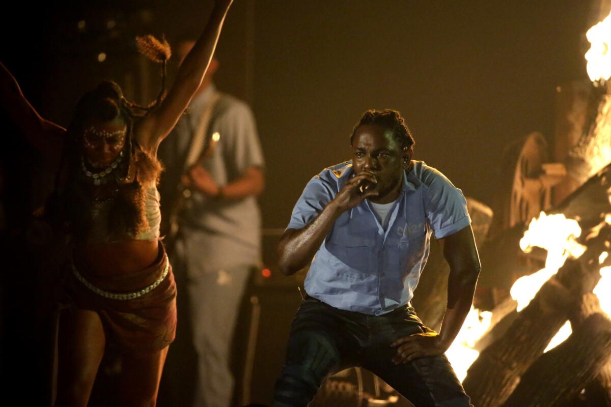 Kendrick Lamar performs Monday at the 58th Grammy Awards at Staples Center. Lamar won five awards, including best rap album.
