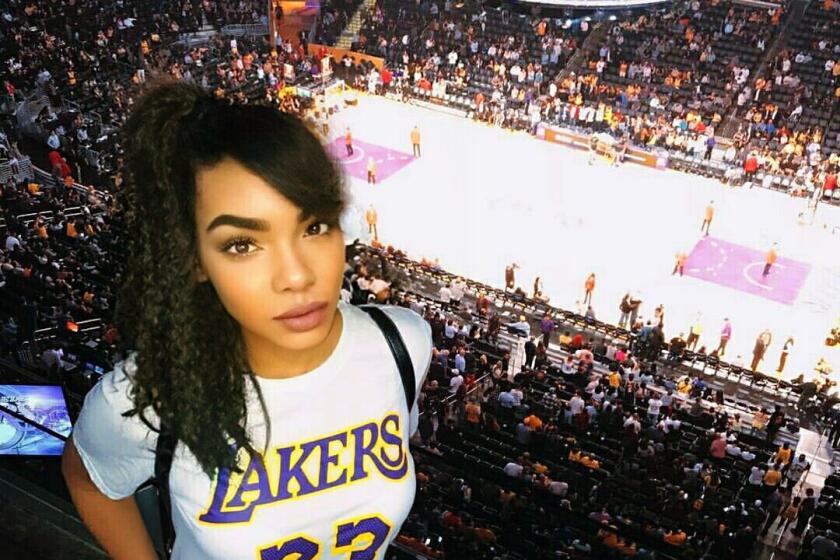 Lakers podcast host Vivan Flores poses at Staples Center in what many claim to be a photoshopped image.