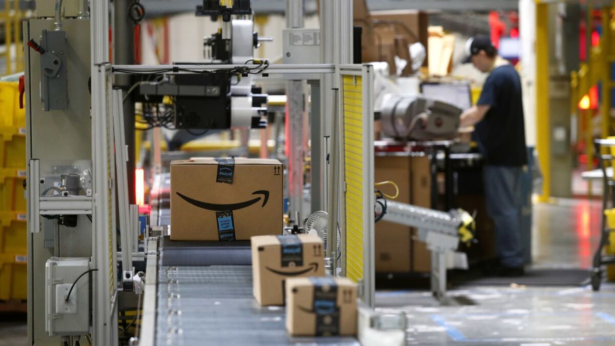 Packages pass through a scanner at an Amazon fulfillment center in Baltimore.