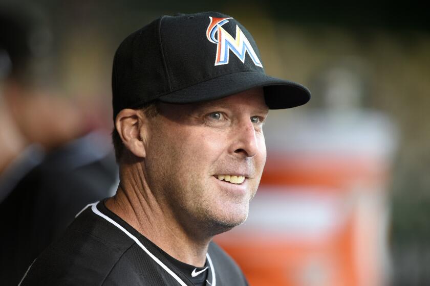 Miami Marlins Manager Mike Redmond looks on from the dugout during a game against the Washington Nationals on May 4.