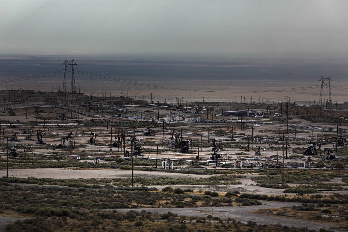 Pump jacks dot the landscape in the Cymric oil field near McKittrick in Kern County
