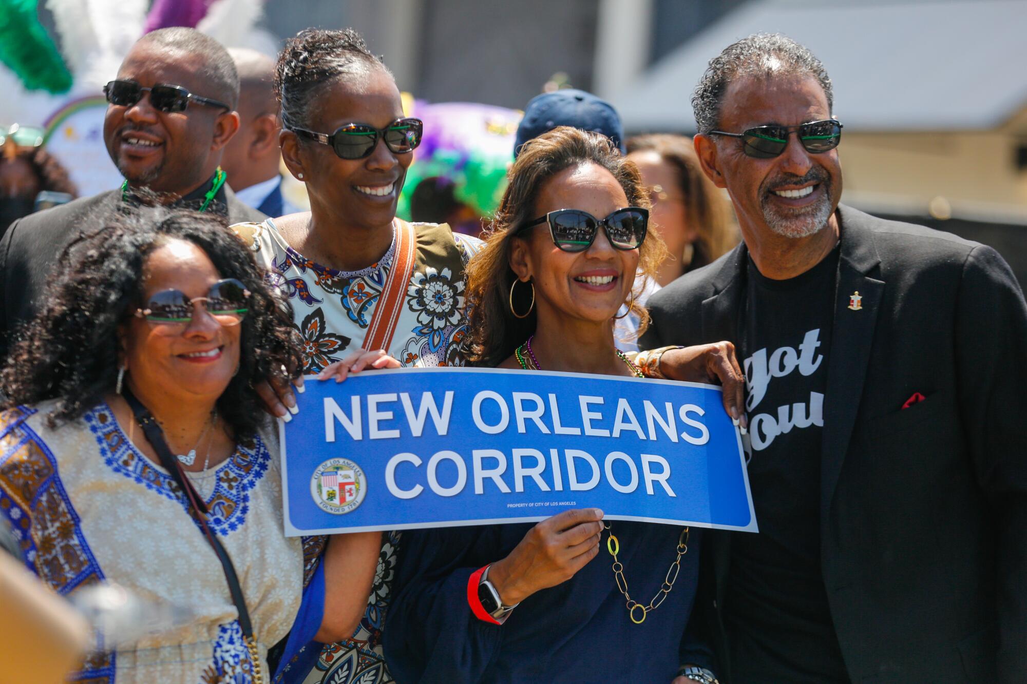 Community members attend a ribbon-cutting ceremony for the newly named, "New Orleans Corridor."