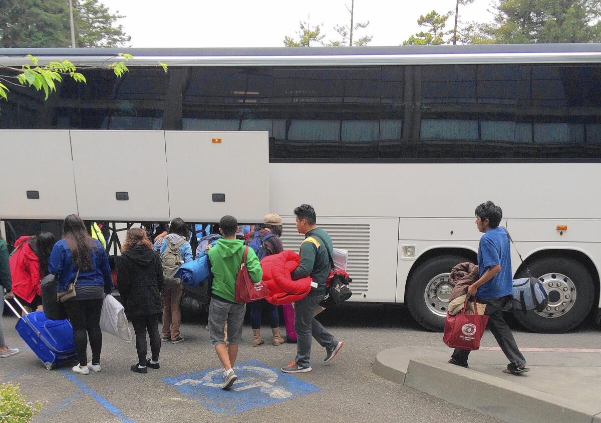 High school students board a bus Saturday morning to return to Los Angeles after their tour of Humboldt State University.