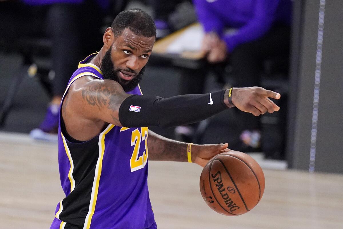 Lakers forward LeBron James sets up a play during the second half of Game 5.