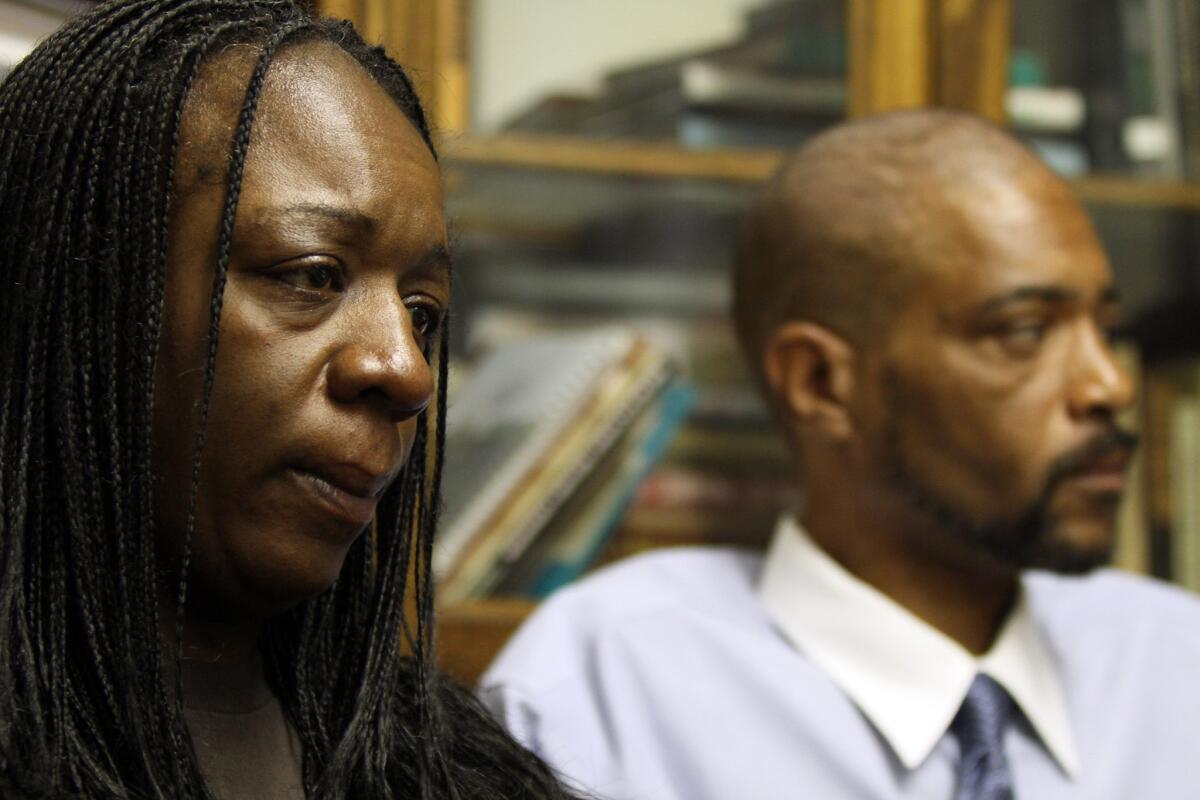 Anya Slaughter, left, whose unarmed son was fatally shot by Pasadena police officers in 2012, has reached a settlement with the city. Above, Slaughter in March 2012.