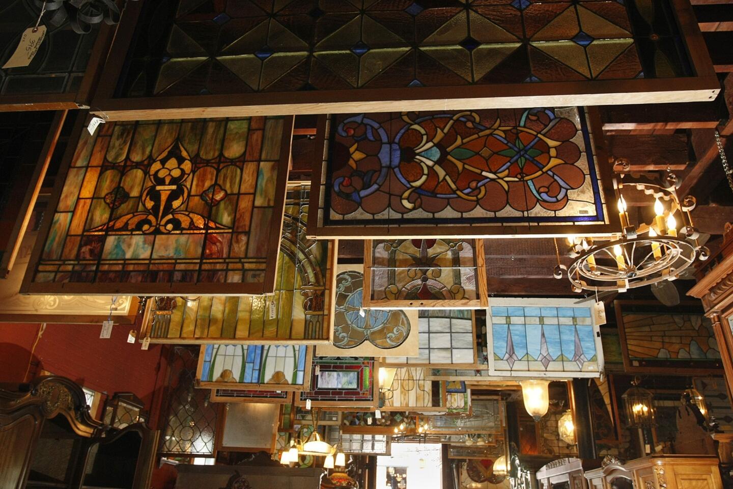 An impressive array of more than 300 stained glass windows hang in the back of the store George II.