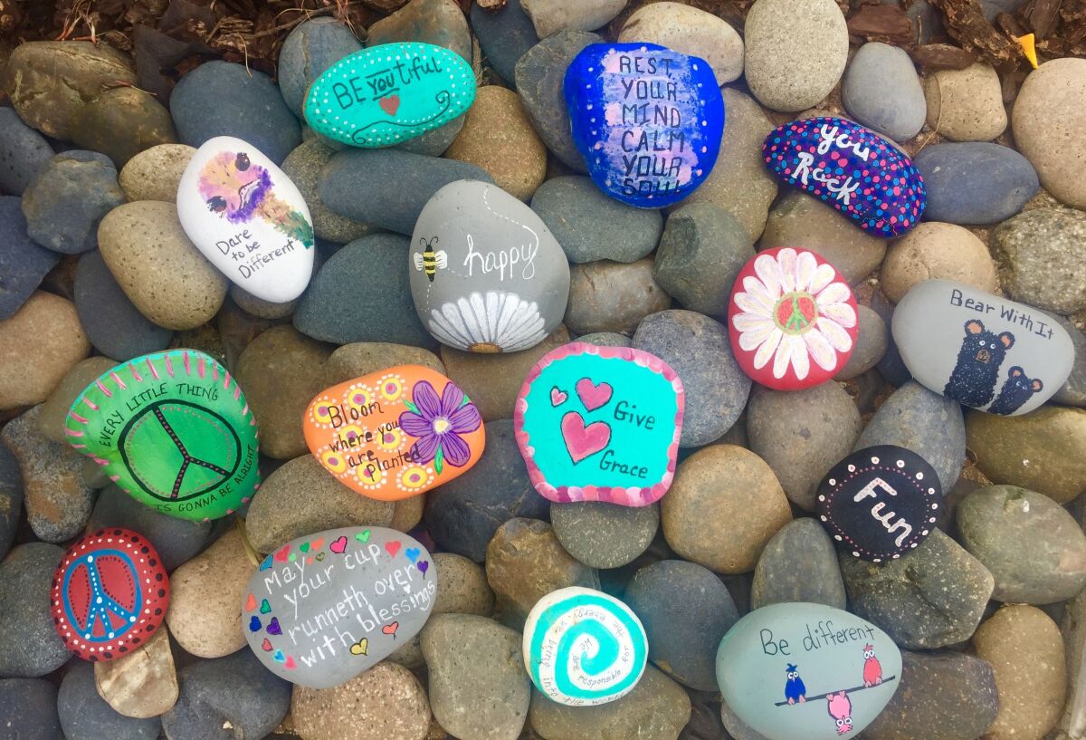 Painted rocks in the rock garden at the home of Oceanside resident Leslie Rush.