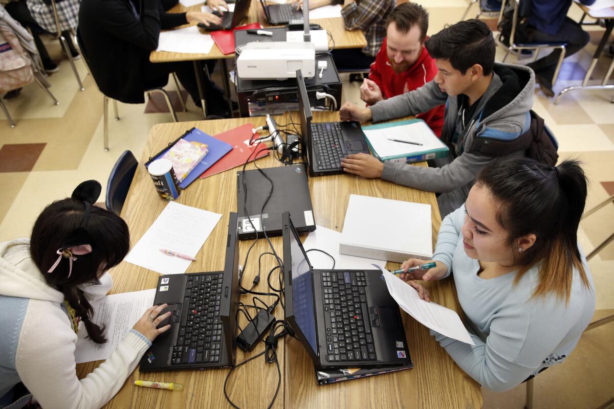 Under a new policy, LAUSD students entering high school this fall will be required to take an ethnic studies course to graduate. Above, 11th-grade students work in class at Francis Polytechnic High School in Sun Valley.