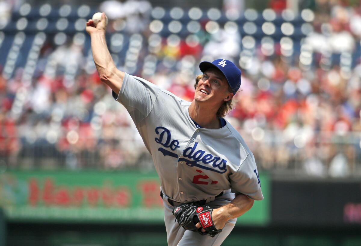 Dodgers starting pitcher Zack Greinke throws during the first inning against the Nationals.