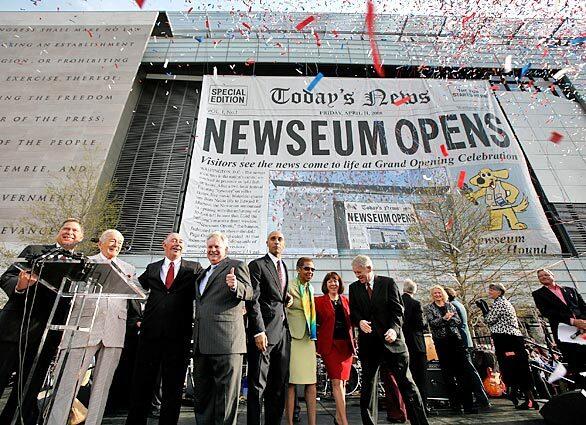 Local politicians and Newseum officials gather at the opening of the $450-million museum in Washington, D.C., that pays tribute to journalism.