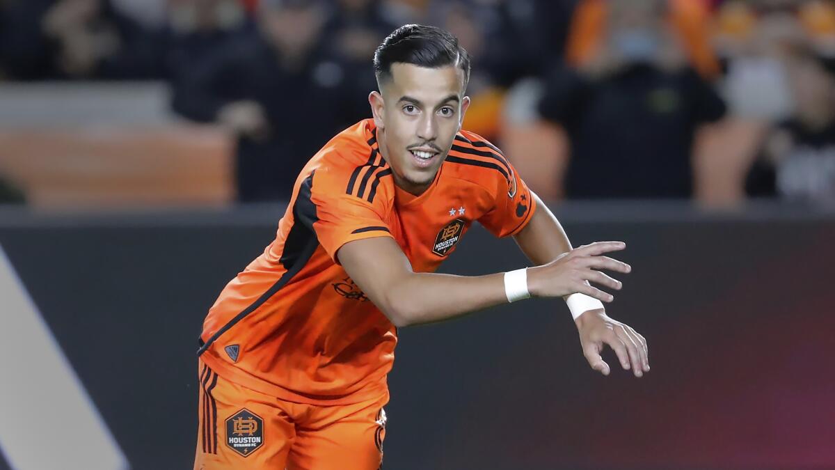 Houston Dynamo midfielder Amine Bassi runs on the field during a match.