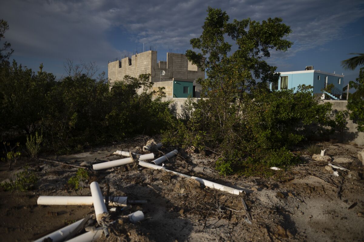Properties are being built at the Jobos Bay National Estuarine Research Reserve, in Salinas, Puerto Rico, Tuesday, May 3, 2022. Puerto Rico's Justice Department has launched a criminal investigation into destruction in the ecological reserve that protects one of the island's most extensive mangrove forests. (AP Photo/Carlos Giusti)