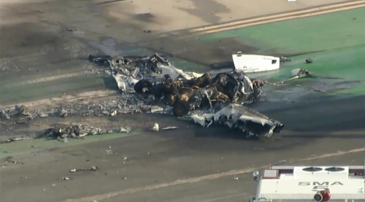 In this image taken from video, firefighters respond to a small plane crash in Santa Monica, Calif. on Thursday, Sept. 8, 2022. Authorities say two people were killed when a single-engine airplane crashed and caught fire at Southern California's Santa Monica Airport. (KABC-7 via AP)
