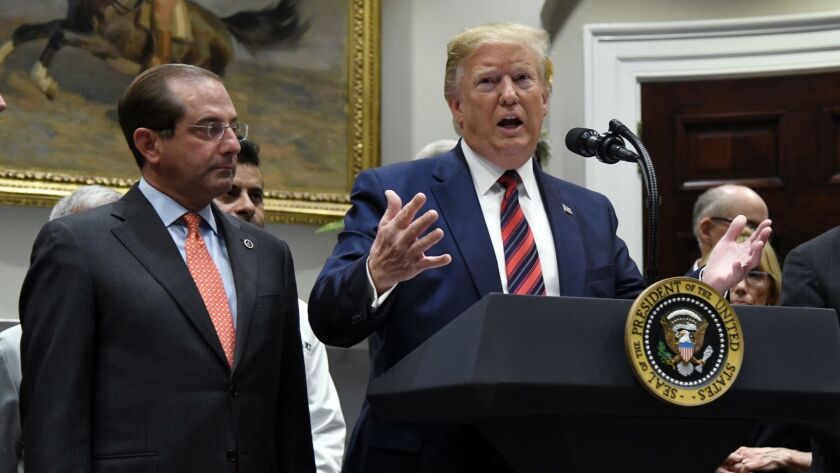 President Trump and Health and Human Services Secretary Alex Azar, shown at a White House ceremony, have terminated potentially live-saving research on ideological grounds.