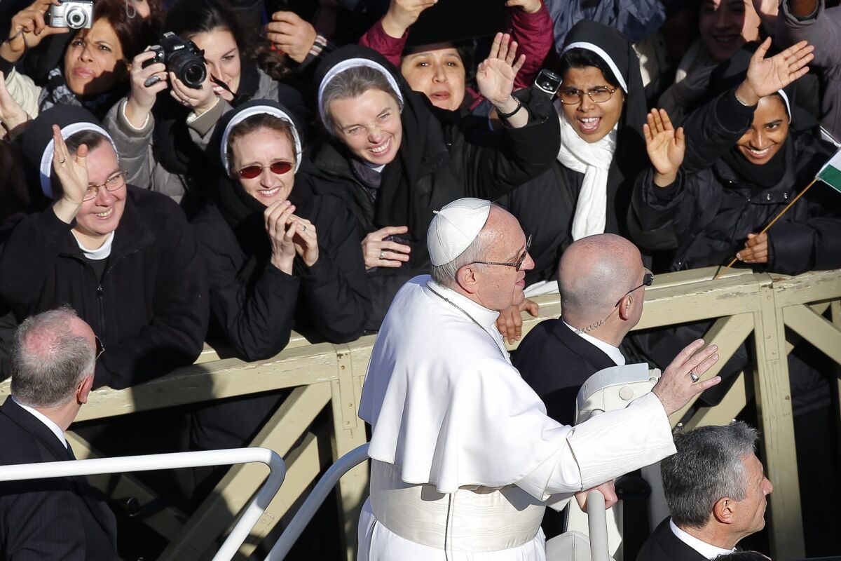 Nuns greet Pope Francis as he arrives in St. Peter's Square for his inauguration Mass at the Vatican last month. The pope has reaffirmed a crackdown by his predecessor, Benedict XVI, on American nuns.