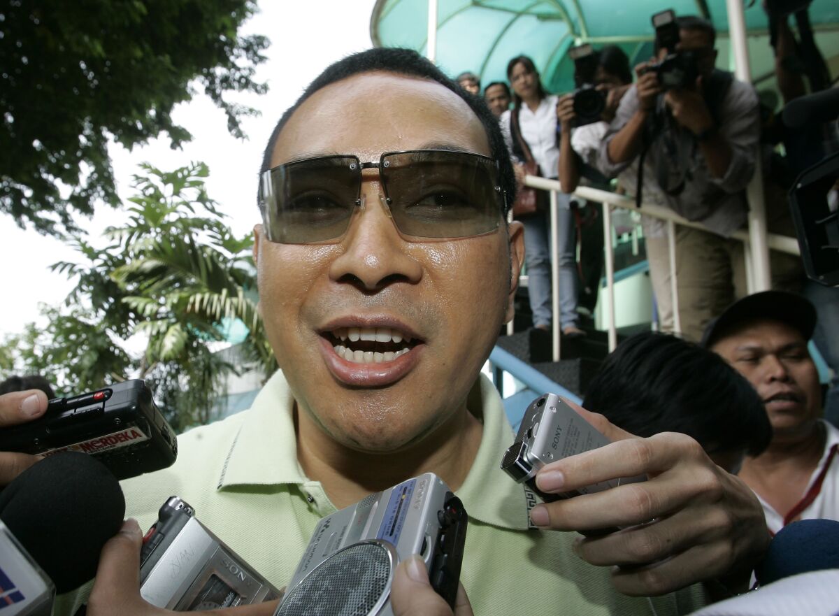 FILE - Hutomo Mandala Putra, or Tommy Suharto, the youngest son of former Indonesian President Suharto is mobbed by journalists upon arrival to visit his father at Pertamina Hospital in Jakarta, Indonesia, Friday, Jan. 11, 2008. Indonesian authorities on Friday, Nov. 5, 2021, seized four plots of land owned by Tommy Suharto as part of efforts to recover money owed the government since the 1997-1998 Asian financial crisis. (AP Photo/Achmad Ibrahim, File)