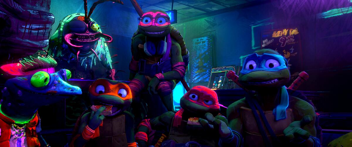 The Teenage Mutant Ninja Turtles and helpers in glow-in-the-dark headgear