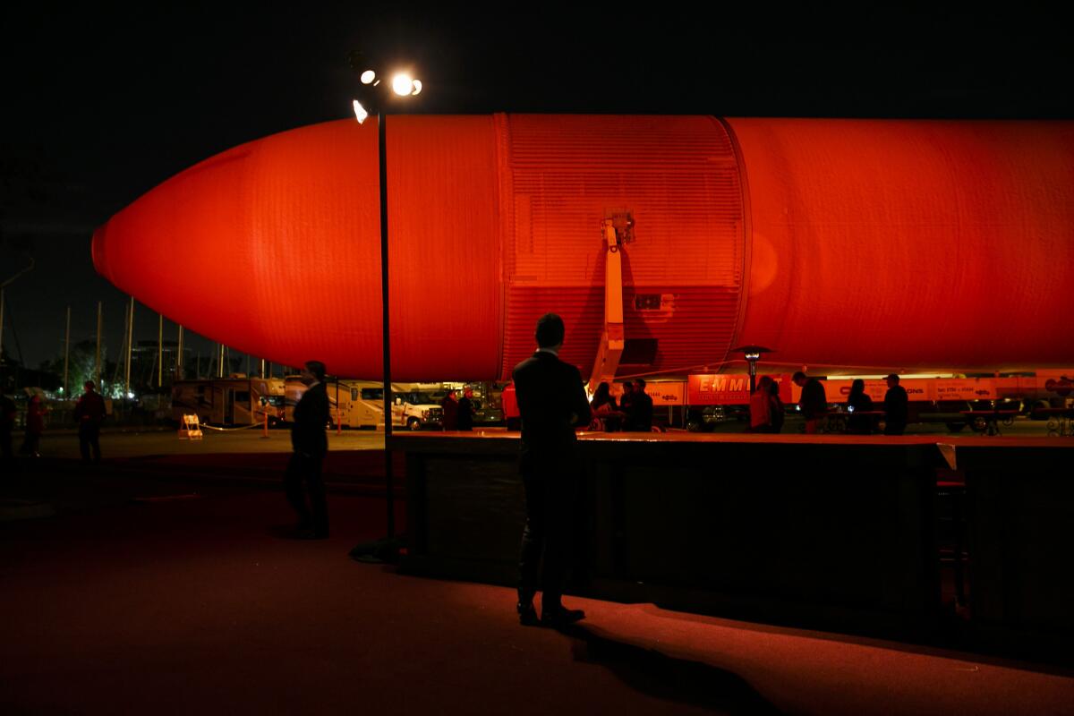 Space shuttle fans watch fuel tank ET-94 before it embarks on its journey to the California Science Center in Exposition Park.