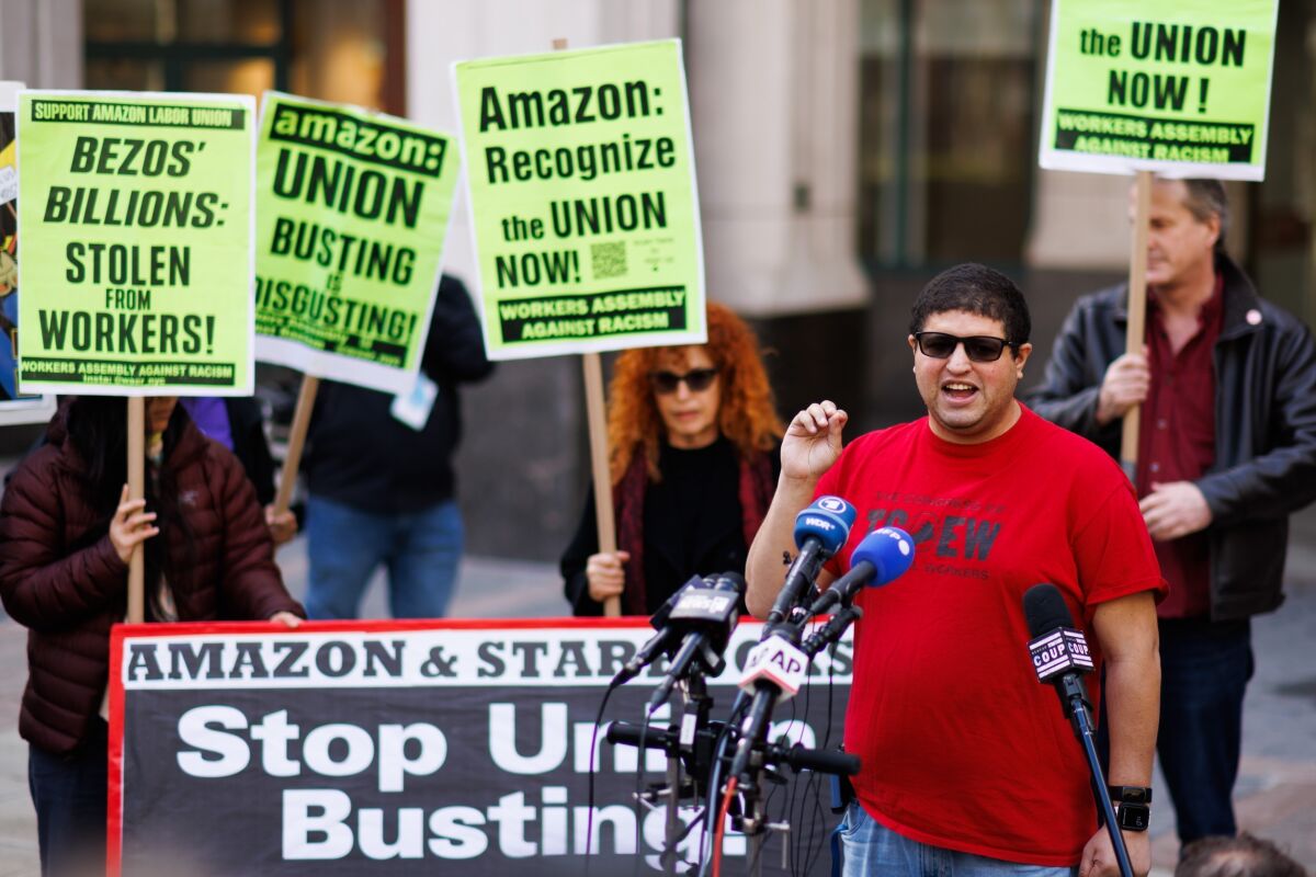 FILE - Amazon JFK8 distribution center union organizer Jason Anthony speaks to media on Friday, April 1, 2022, in the Brooklyn borough of New York. The top lawyer for the National Labor Relations Board said Thursday, April 7, she will ask the board to rule that mandatory meetings some companies hold to persuade their workers reject unions is in violation of federal labor law. (AP Photo/Eduardo Munoz Alvarez)