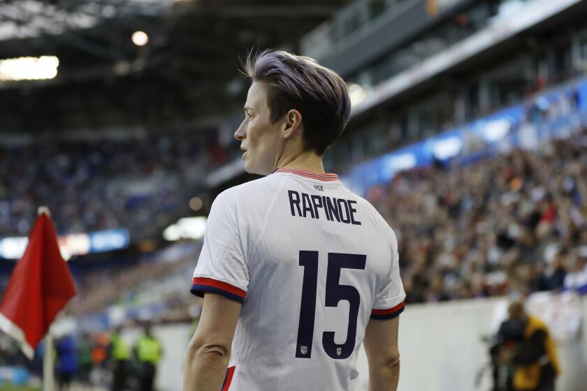 United States forward Megan Rapinoe (15) looks out to her teammates before delivering a corner kick during the second half of a SheBelieves Cup soccer match against Spain Sunday, March 8, 2020, in Harrison, N.J. The United States won 1-0. (AP Photo/Steve Luciano)
