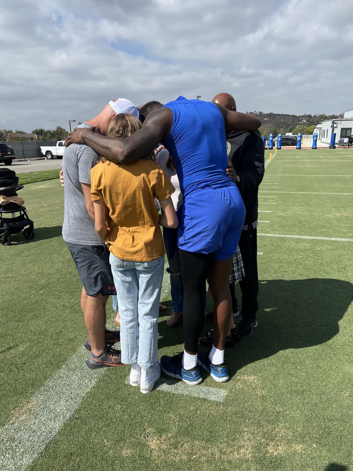 Carter Stone family members huddle together outside.