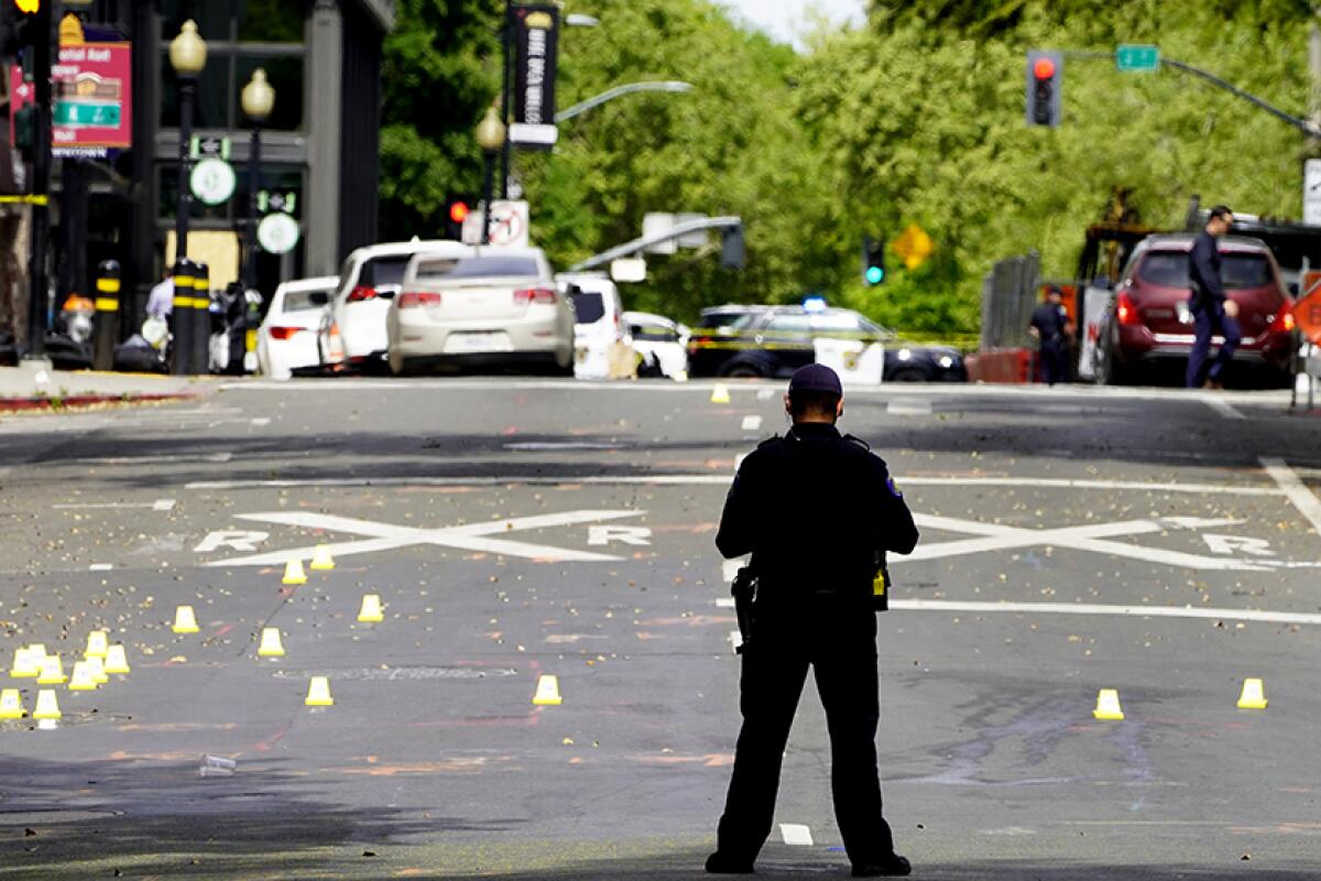 An officer at the scene of a mass shooting in Sacramento on Sunday.