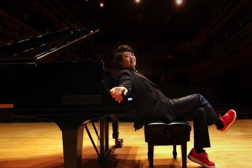 Chinese pianist Lang Lang, photographed at Carnegie Hall in New York, will appear at the 2014 Grammy Awards alongside the heavy-metal band Metallica.