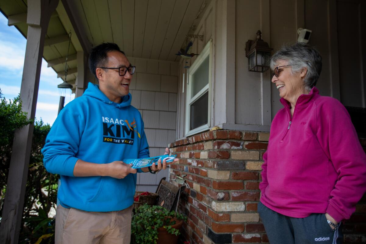 Isaac Kim, left, is a candidate for the City Council District 6 race