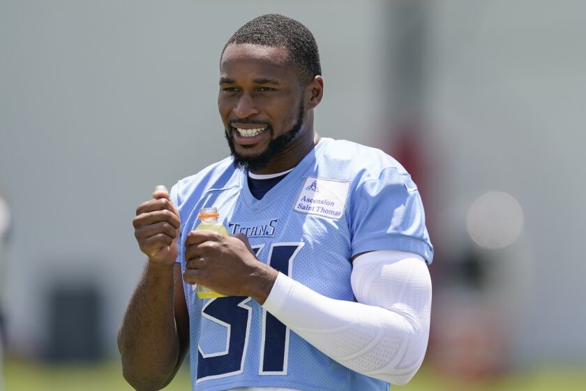 Tennessee Titans safety Kevin Byard (31) take a drink during practice at the NFL football team's training facility Tuesday, June 6, 2023, in Nashville, Tenn. (AP Photo/George Walker IV)
